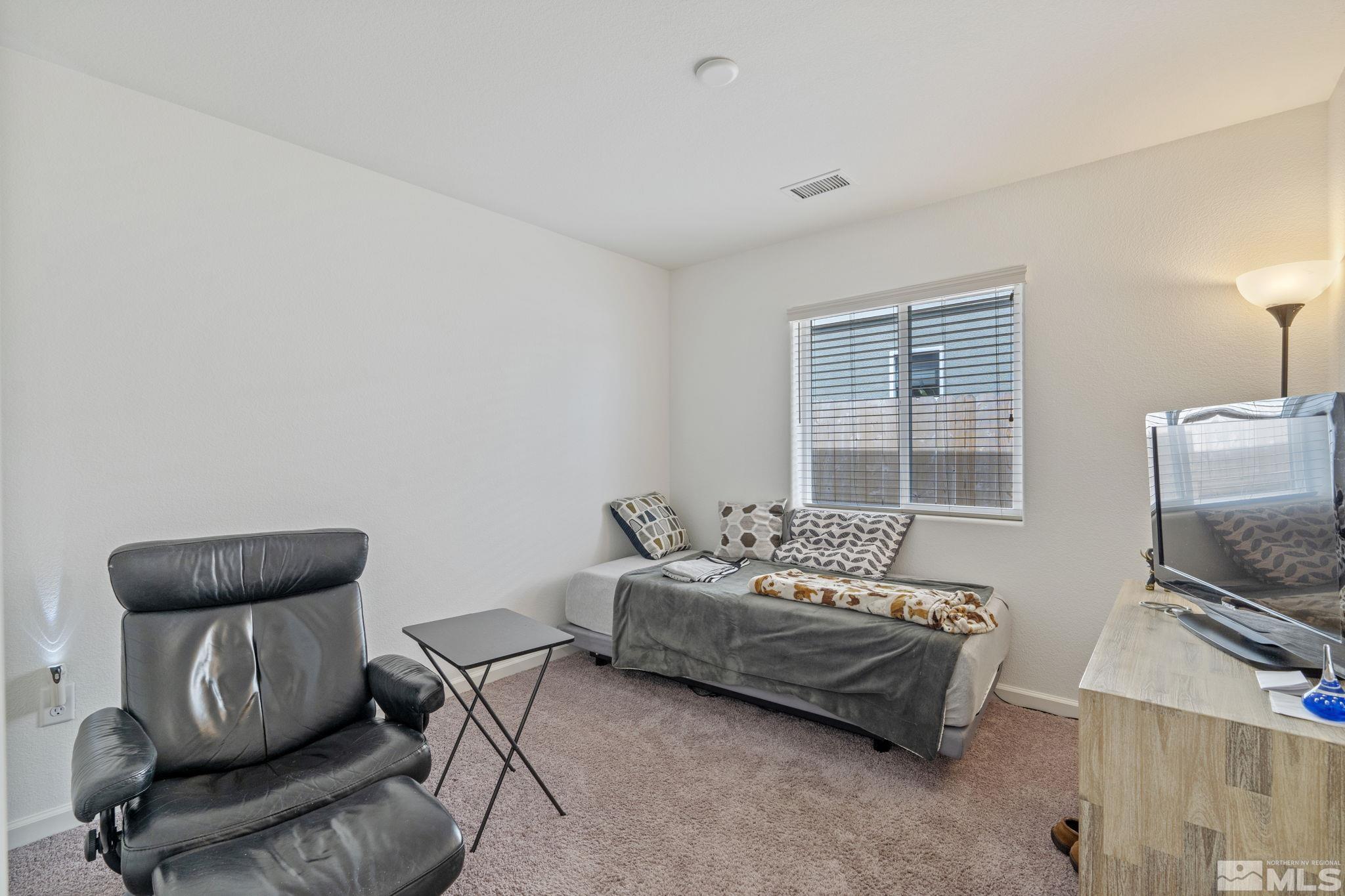 677 Mcgill Drive Reno, NV 89506 - Photo 15 of 29 a living room with furniture and a flat screen tv