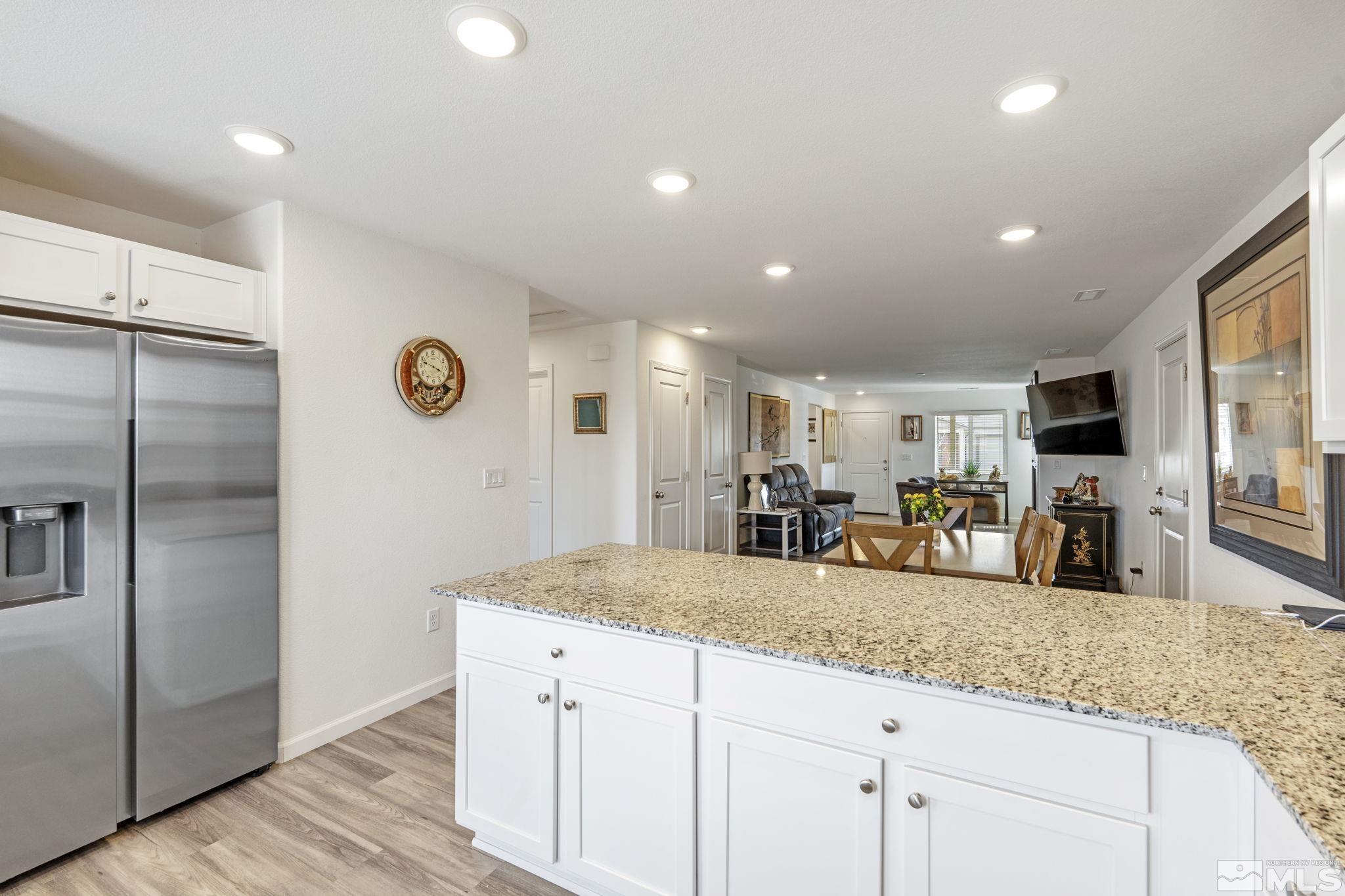 677 Mcgill Drive Reno, NV 89506 - Photo 19 of 29 a kitchen with sink refrigerator and microwave