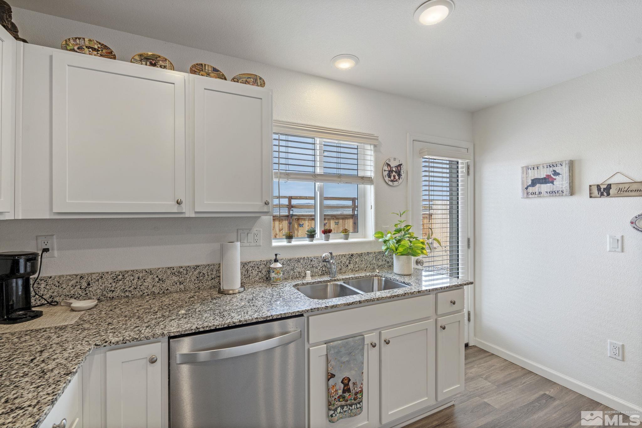 677 Mcgill Drive Reno, NV 89506 - Photo 20 of 29 a kitchen with granite countertop a sink and a window