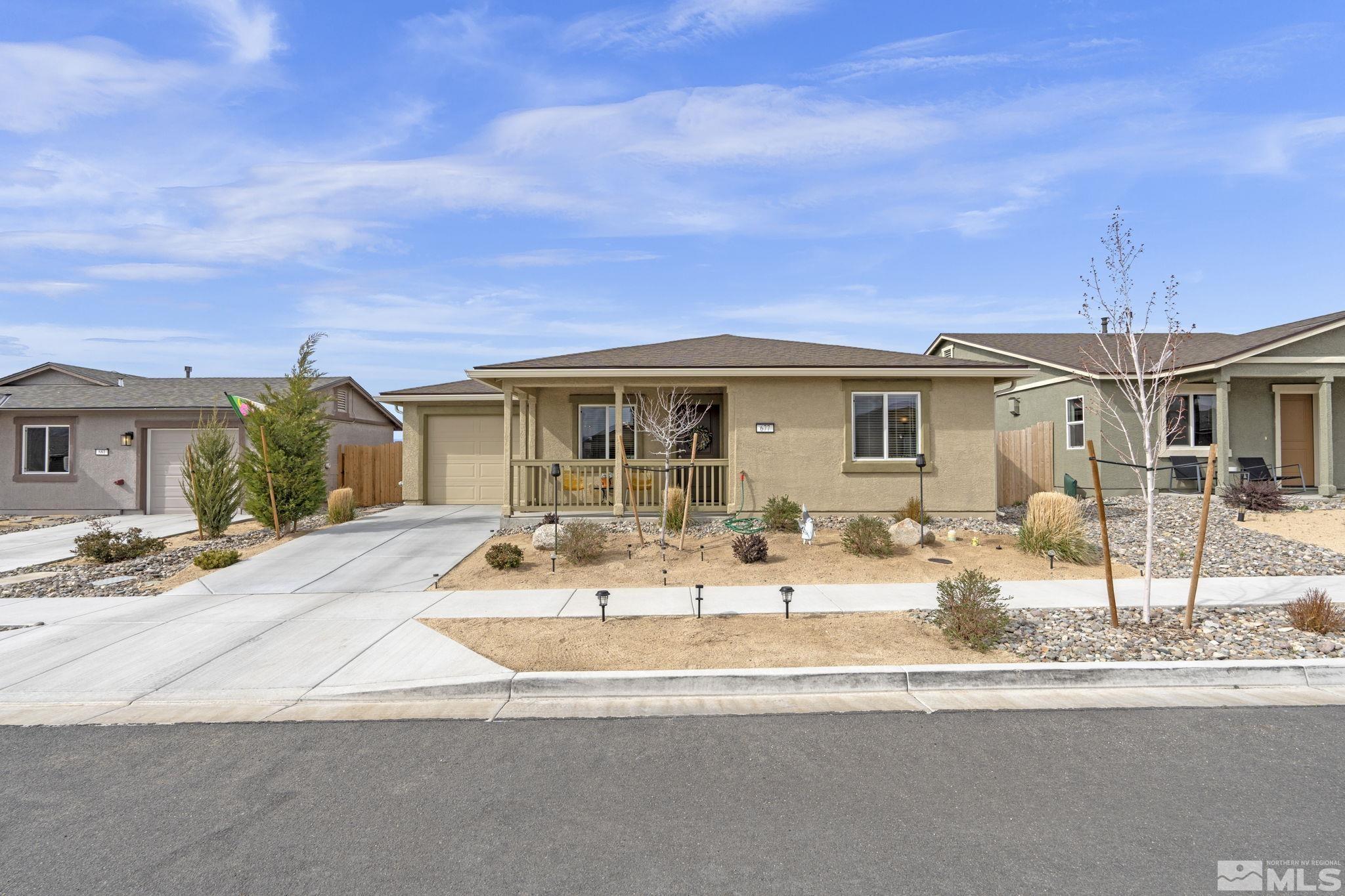 677 Mcgill Drive Reno, NV 89506 - Photo 2 of 29 a front view of a house with garden and patio