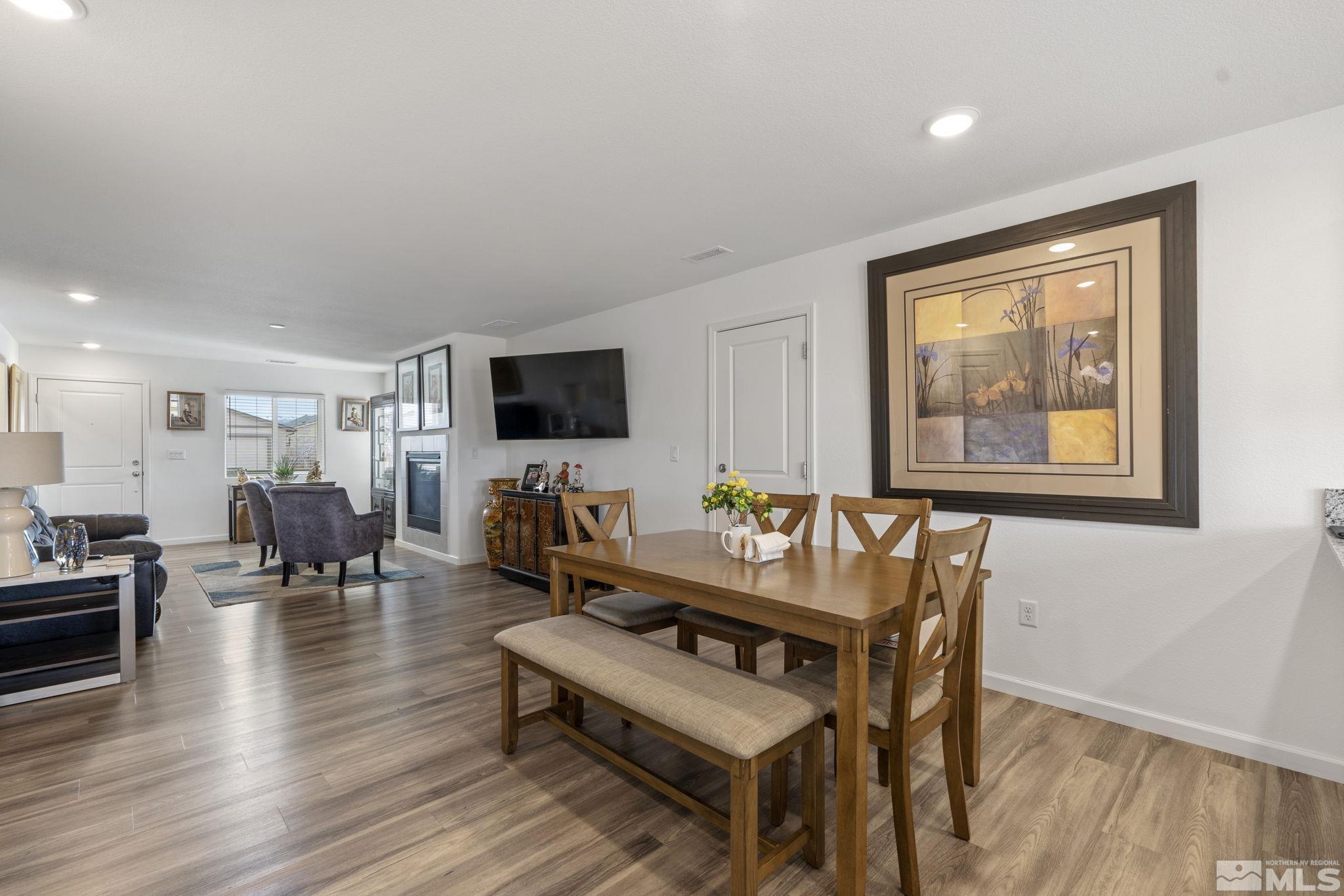677 Mcgill Drive Reno, NV 89506 - Photo 27 of 29 a living room with furniture a wooden floor and a flat screen tv