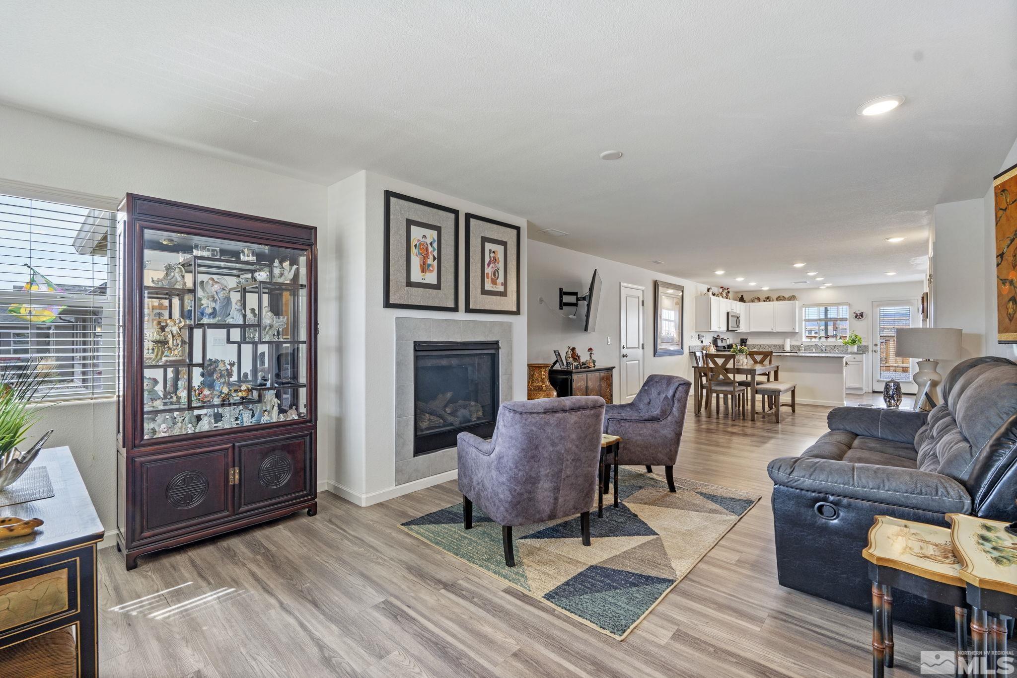677 Mcgill Drive Reno, NV 89506 - Photo 28 of 29 a living room with furniture a fireplace and a table