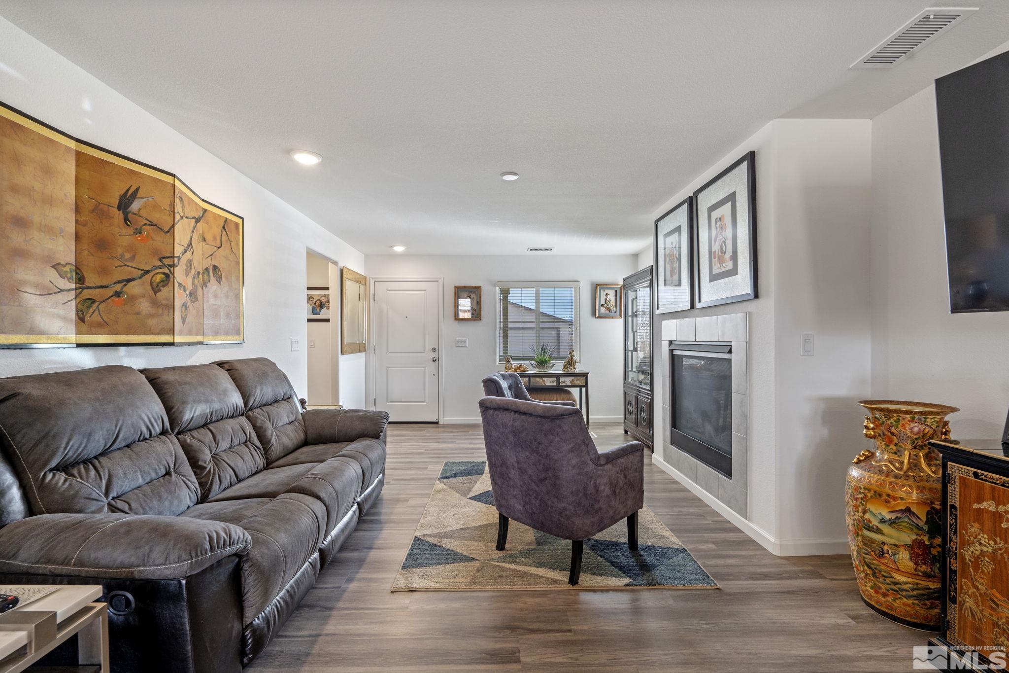 677 Mcgill Drive Reno, NV 89506 - Photo 5 of 29 a living room with furniture and a flat screen tv