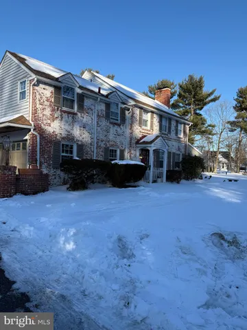 a view of a big house with a yard