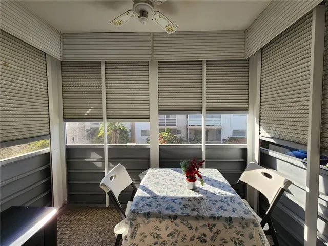 a view of a hallway with wooden floor and closet