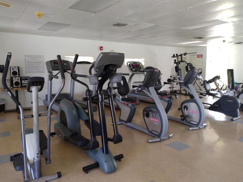 17090 Northeast 14th Avenue, Unit 211 North Miami Beach, FL 33162 - Photo 20 of 26 a view of a room with gym equipment
