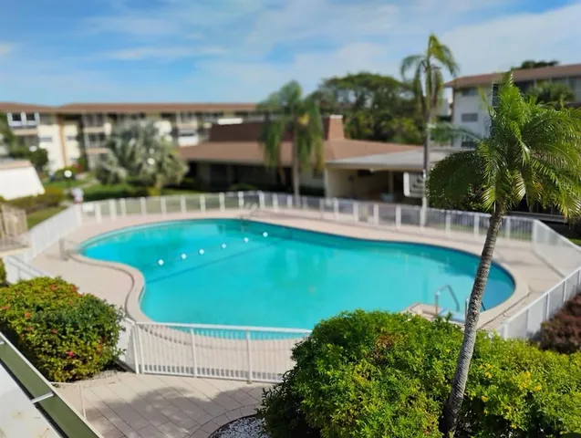 a view of a house with a swimming pool