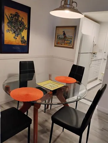 a close view of kitchen sink stove and refrigerator