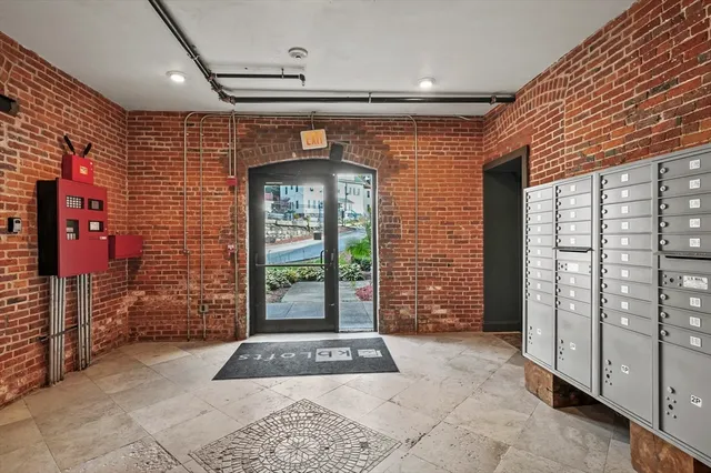 a view of entryway with a brick wall