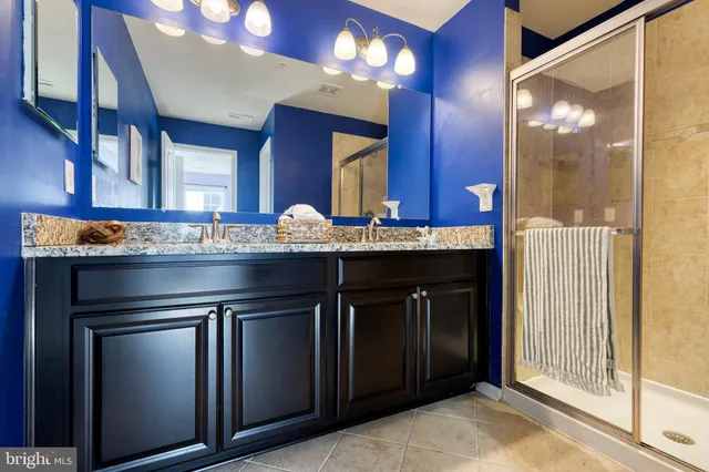 a kitchen with a sink and a mirror