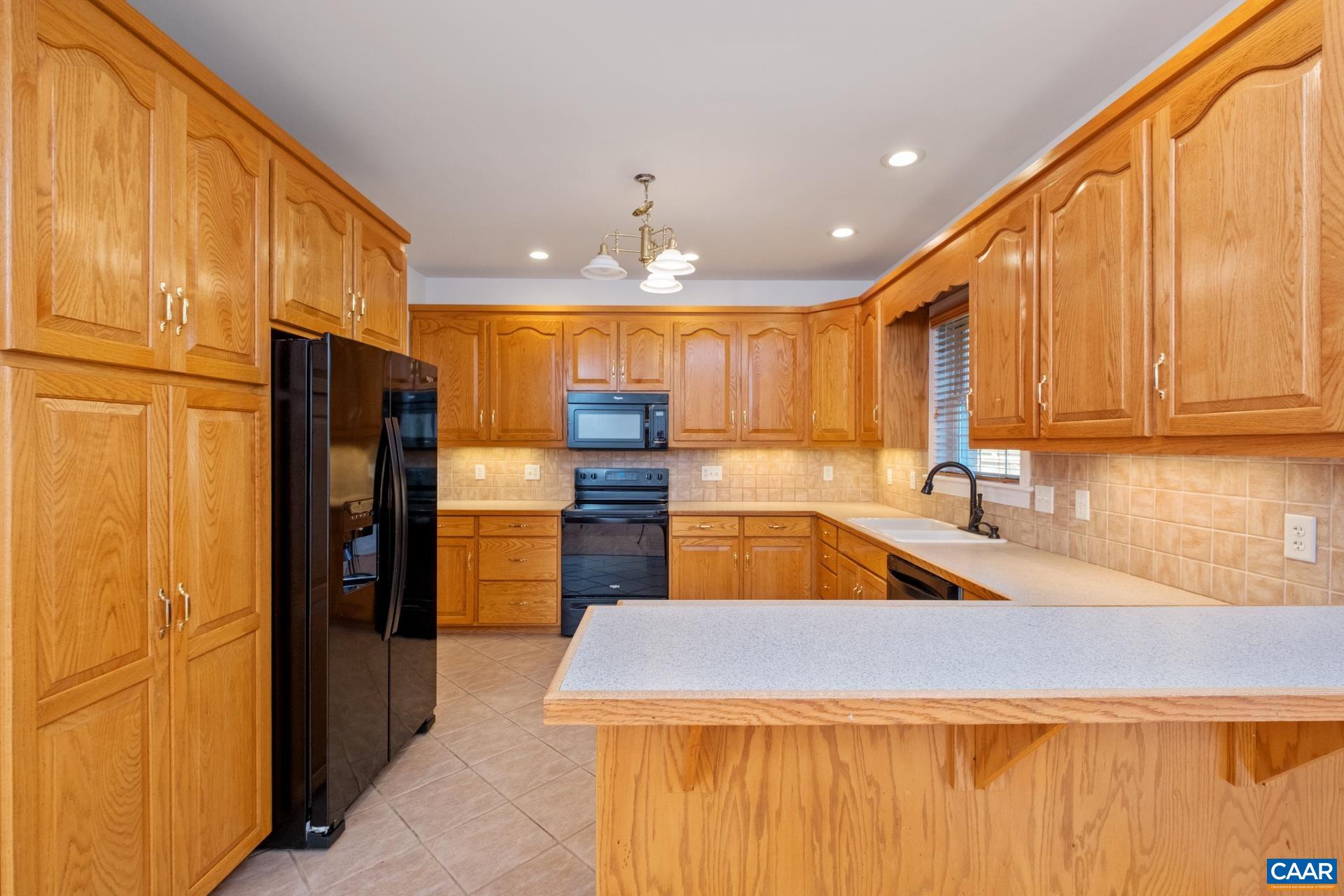 7550 Plank Road Afton, VA 22920 - Photo 16 of 49 a kitchen with stainless steel appliances granite countertop a refrigerator and a sink