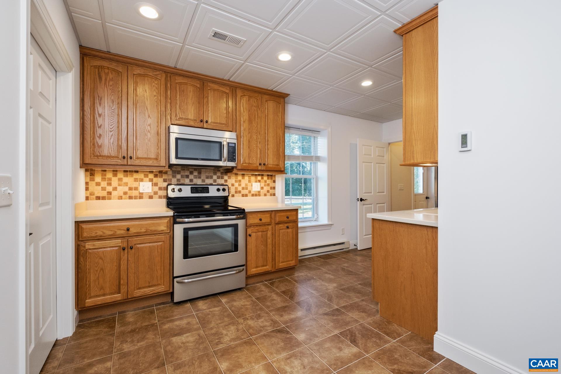 7550 Plank Road Afton, VA 22920 - Photo 30 of 49 a kitchen with stainless steel appliances granite countertop a stove a sink and a refrigerator
