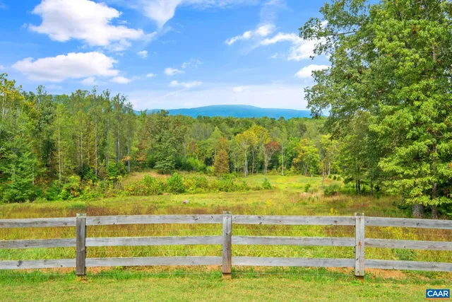 a view of a garden with an ocean view
