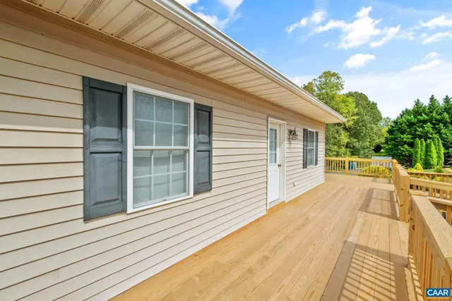 a view of house with backyard