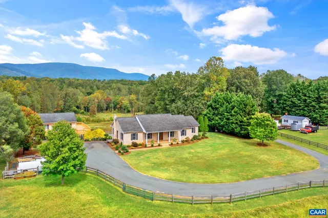 a view of a swimming pool with a yard