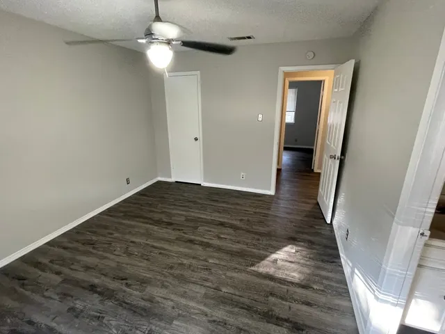 a kitchen with a stove and a refrigerator
