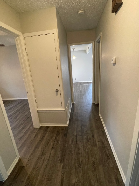 12613 Tree Line Drive, Unit A Austin, TX 78729 - Photo 14 of 15 a view of a hallway with wooden floor