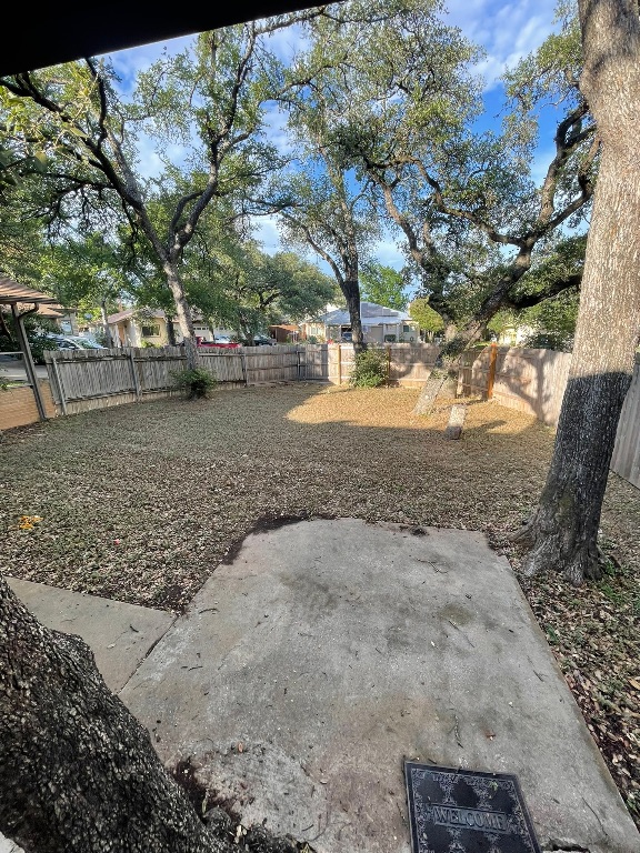 12613 Tree Line Drive, Unit A Austin, TX 78729 - Photo 15 of 15 a view of yard with trees
