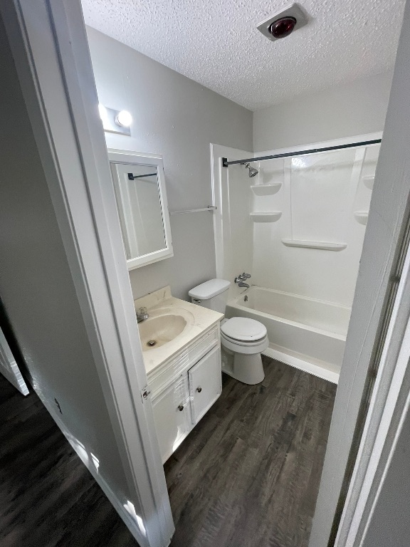 12613 Tree Line Drive, Unit A Austin, TX 78729 - Photo 9 of 15 a bathroom with a double vanity sink toilet and shower