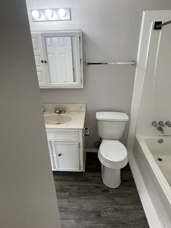 12613 Tree Line Drive, Unit A Austin, TX 78729 - Photo 10 of 15 a bathroom with a sink toilet a mirror and bathtub