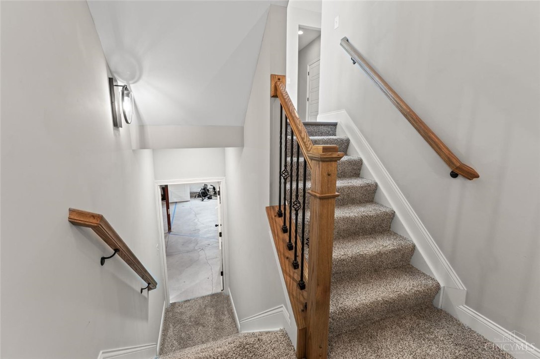 2425 Middleboro Road Clarksville, OH 45113 - Photo 87 of 91 This interior staircase features carpet flooring, leading to an interior entry.