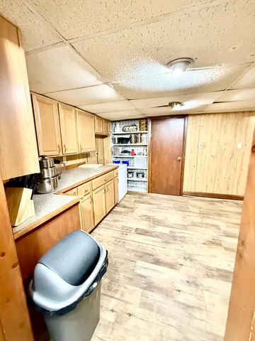a large kitchen with stainless steel appliances granite countertop a sink and cabinets