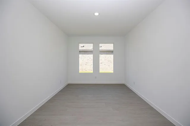 a view of a kitchen with a sink and stainless steel appliances