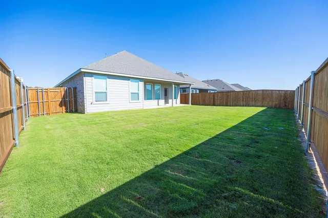 a view of a house with a big yard