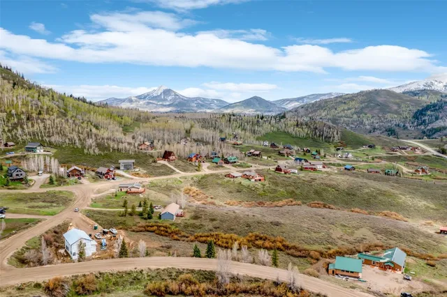 a view of a city with mountains in the background