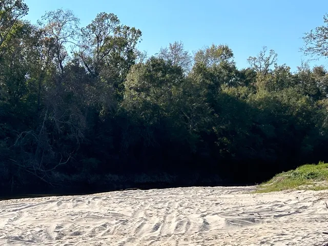 a view of wooden fence in front of a house