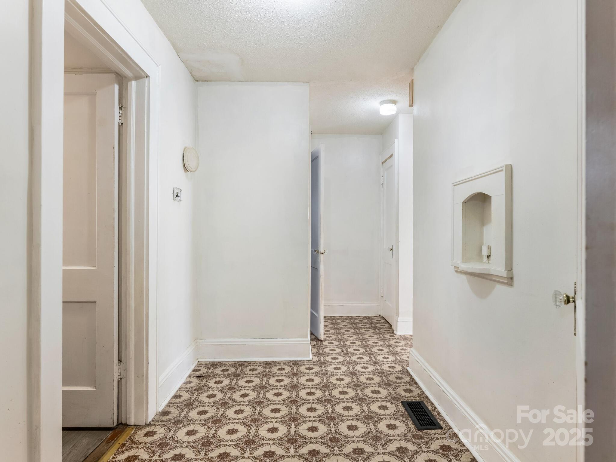 1008 Mable Avenue Kannapolis, NC 28083 - Photo 12 of 26 a view of a hallway with wooden floor