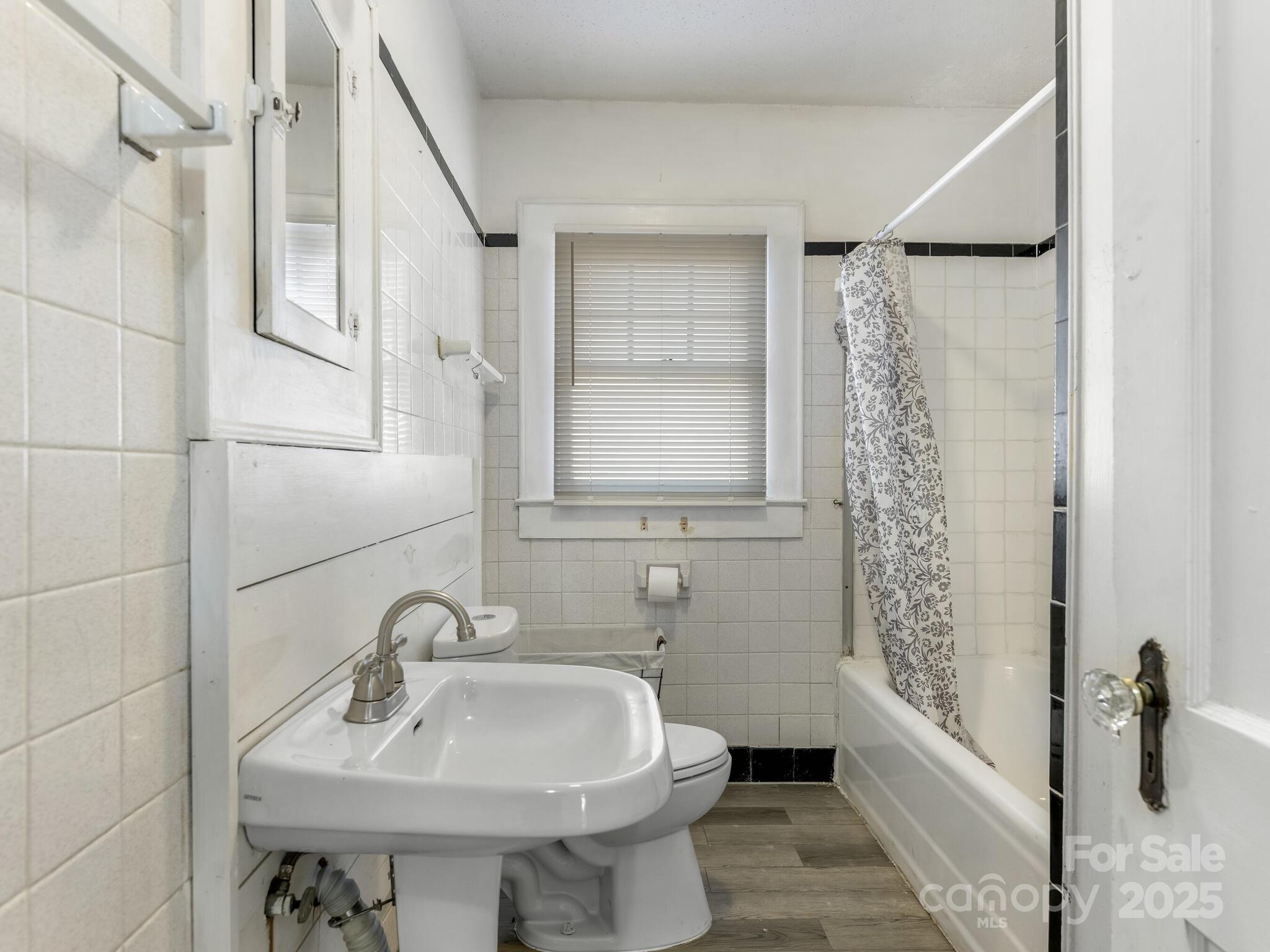 1008 Mable Avenue Kannapolis, NC 28083 - Photo 17 of 26 a bathroom with a sink toilet and tub