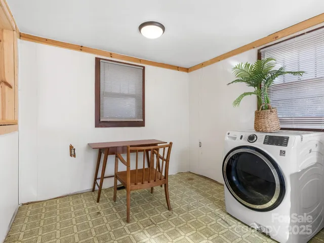 a view of a workspace with furniture and entryway