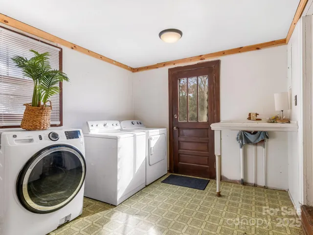 a utility room with closet dryer and washer