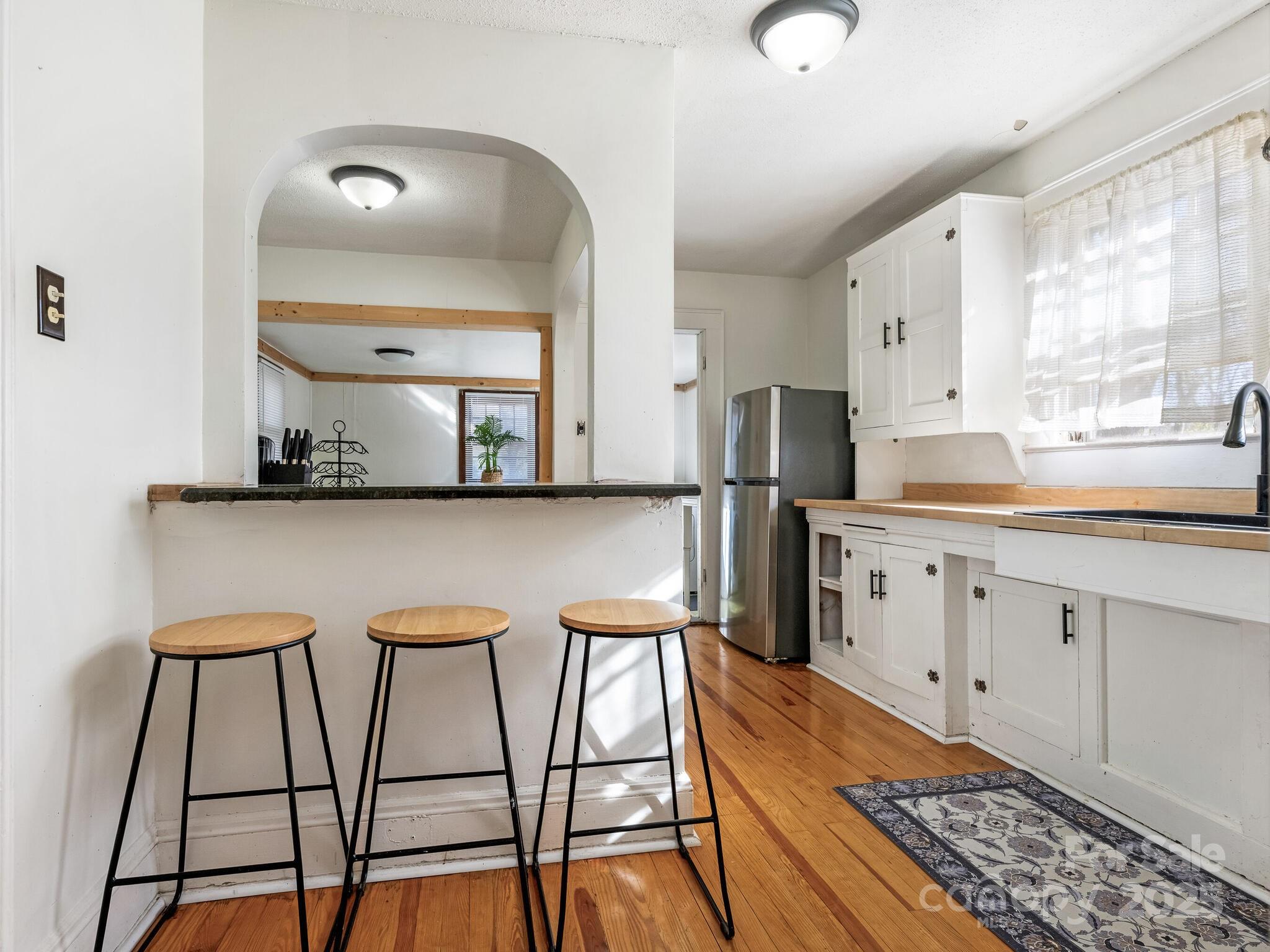 1008 Mable Avenue Kannapolis, NC 28083 - Photo 8 of 26 a kitchen with stainless steel appliances kitchen island granite countertop a sink and cabinets
