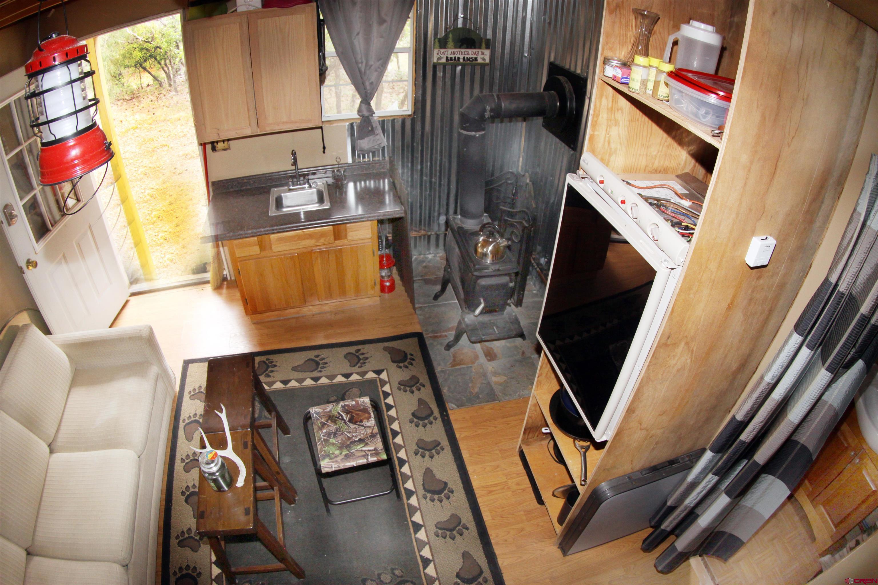 543 Justin's Road Pagosa Springs, CO 81147 - Photo 13 of 41 a view of living room with furniture and a flat screen tv