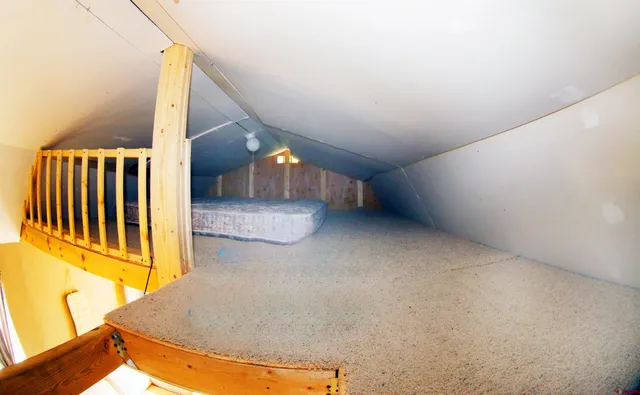 a view of a balcony with chairs