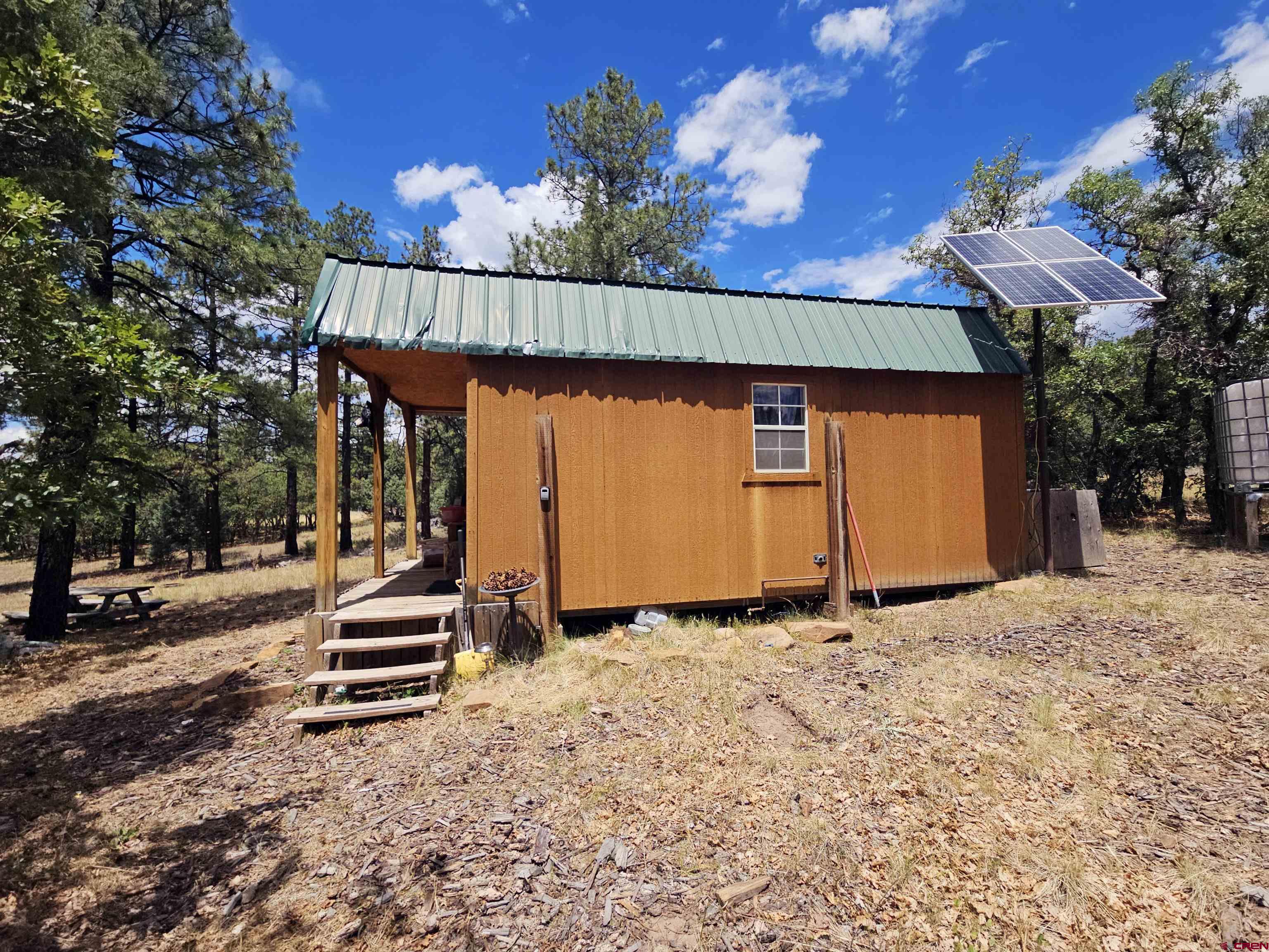 543 Justin's Road Pagosa Springs, CO 81147 - Photo 30 of 41 a view of a house with wooden fence