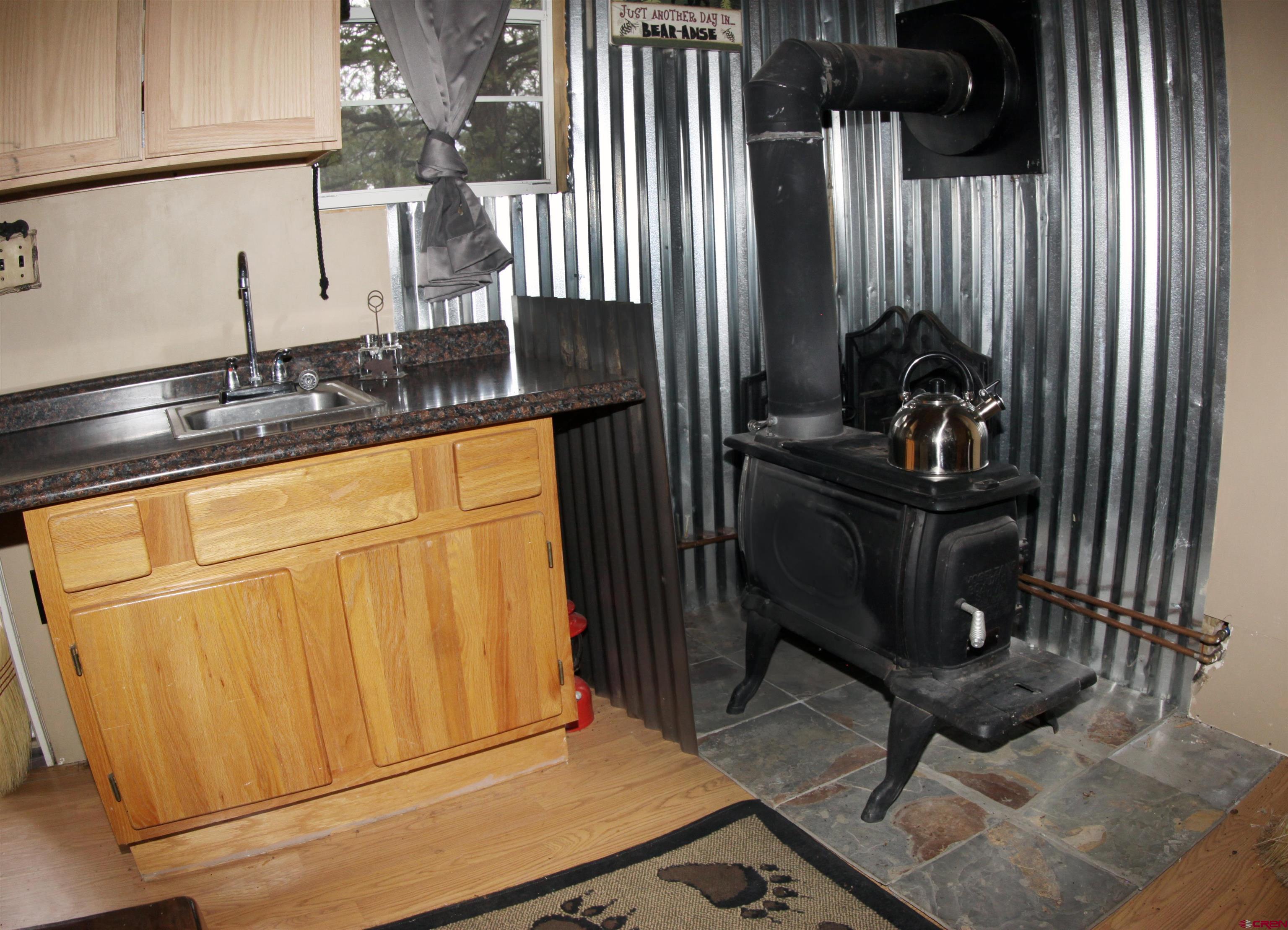543 Justin's Road Pagosa Springs, CO 81147 - Photo 9 of 41 a view of a kitchen with car parked
