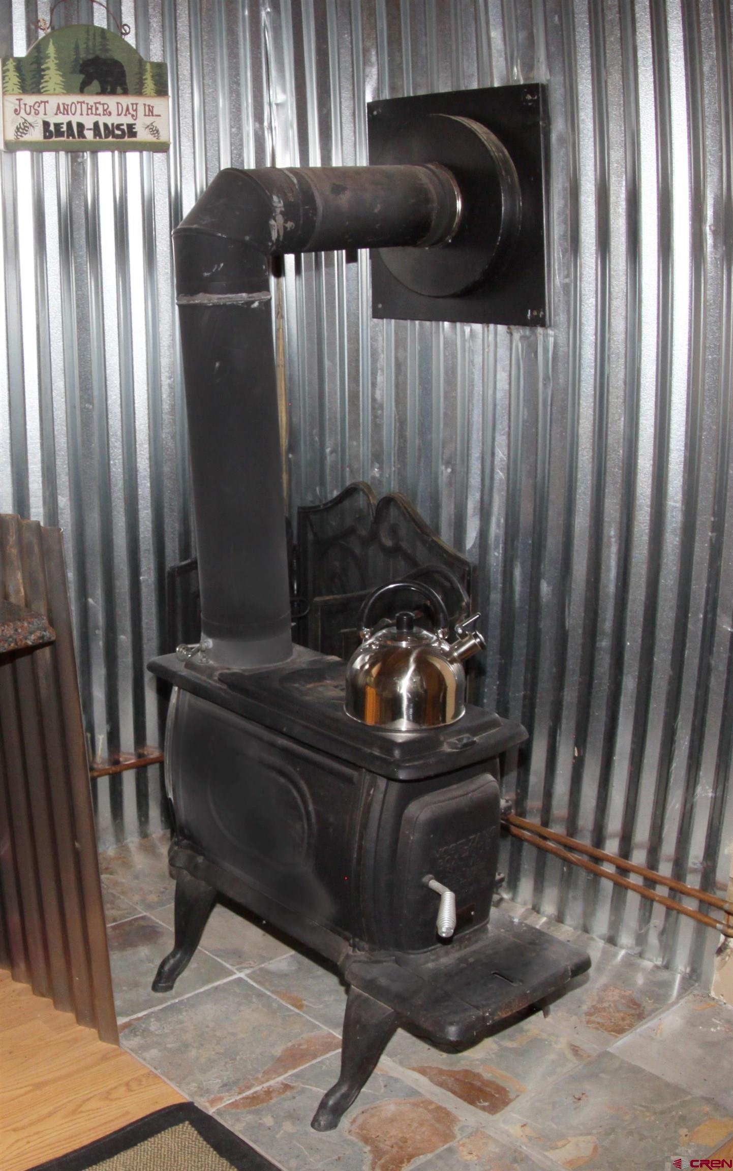 543 Justin's Road Pagosa Springs, CO 81147 - Photo 10 of 41 a bed sitting in a room next to a window