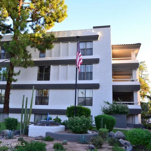 a front view of a building with garden