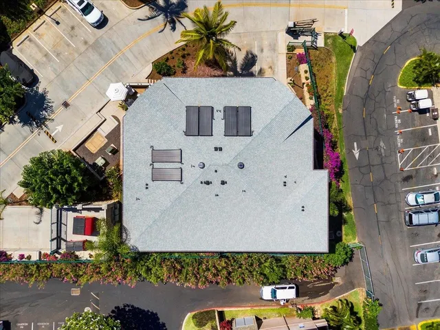 a view of a patio with table and chairs and potted plants