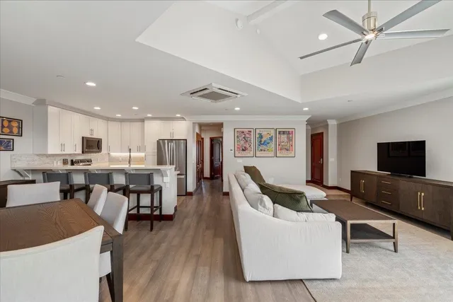 a kitchen with stainless steel appliances a refrigerator and microwave