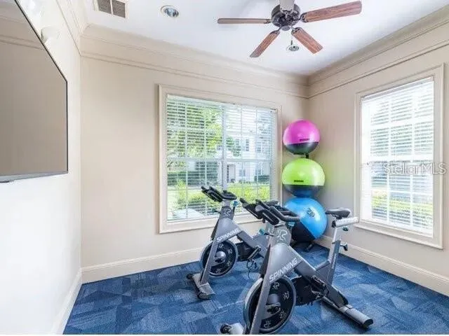 a view of a room with workspace and windows