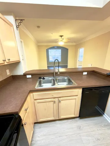 a kitchen with a sink and a stove