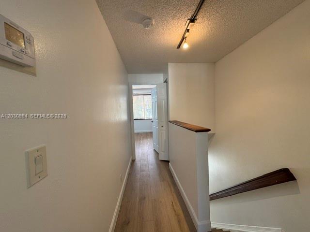 192 Southwest 96th Avenue, Unit 192 Plantation, FL 33324 - Photo 10 of 15 a view of a hallway with wooden floor