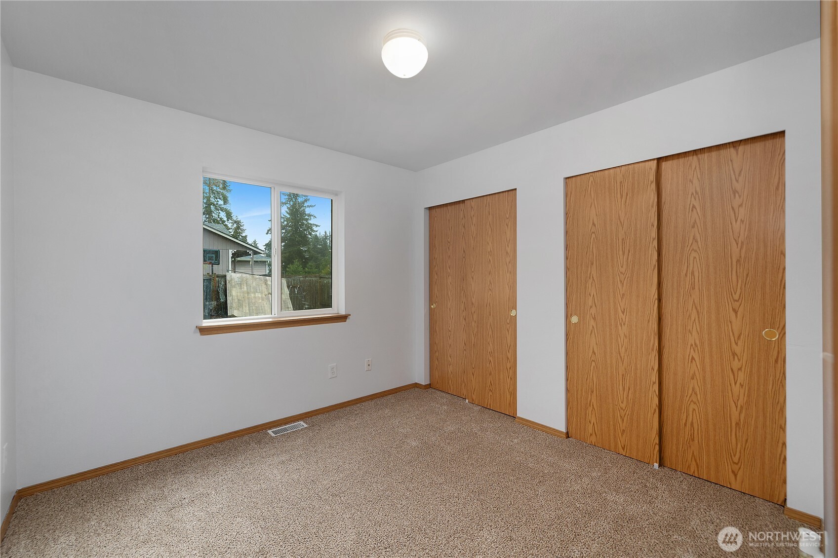 7606 187th Avenue Southwest Rochester, WA 98579 - Photo 23 of 28 an empty room with windows
