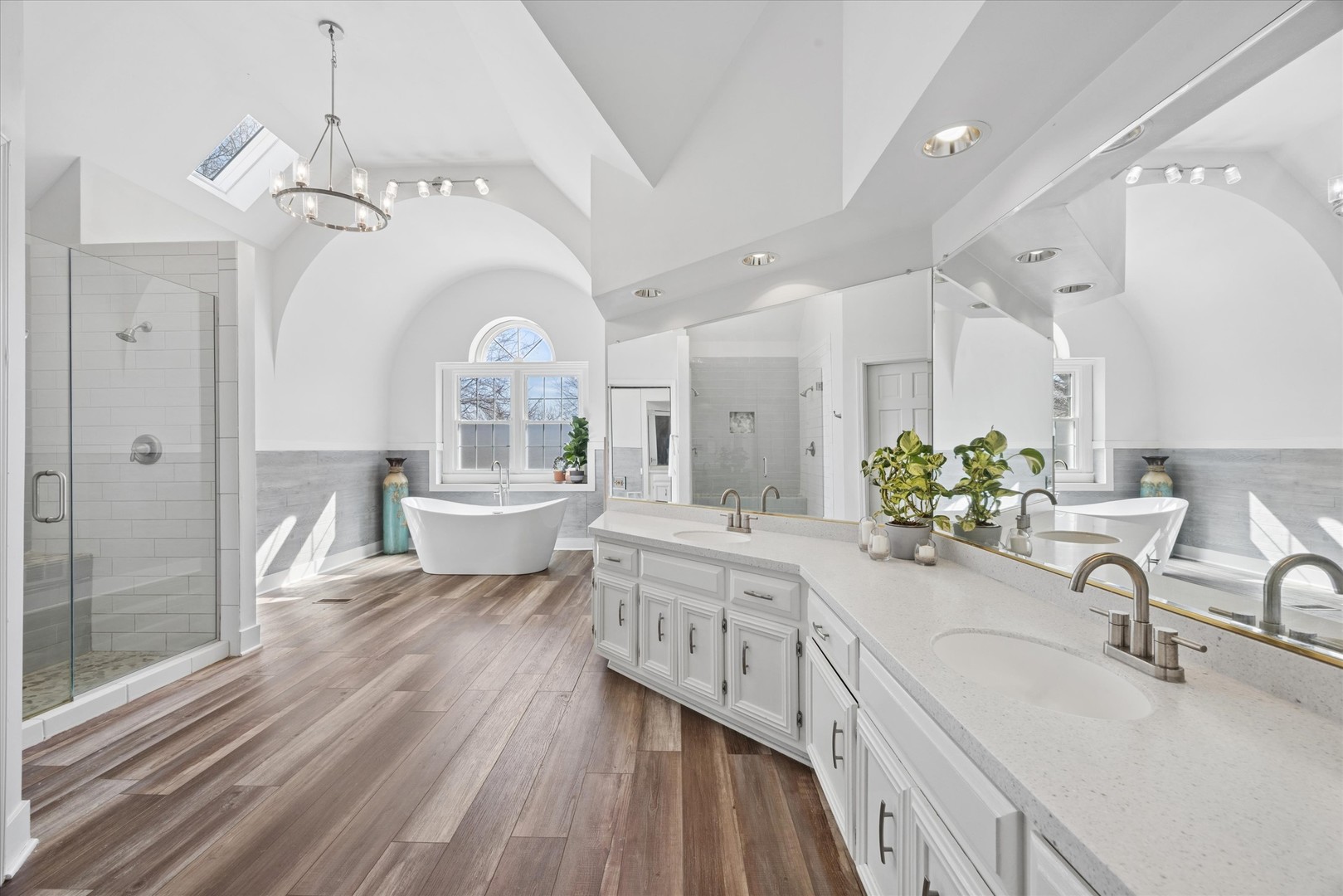 2711 Wendy Road Naperville, IL 60565 - Photo 24 of 49 a spacious bathroom with a double vanity sink a mirror and a bathtub