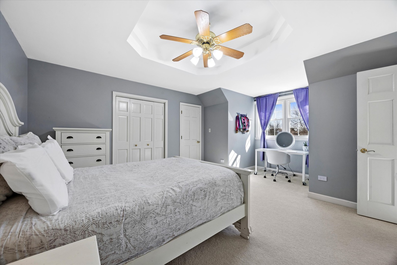 2711 Wendy Road Naperville, IL 60565 - Photo 25 of 49 a bedroom with a bed and a chandelier