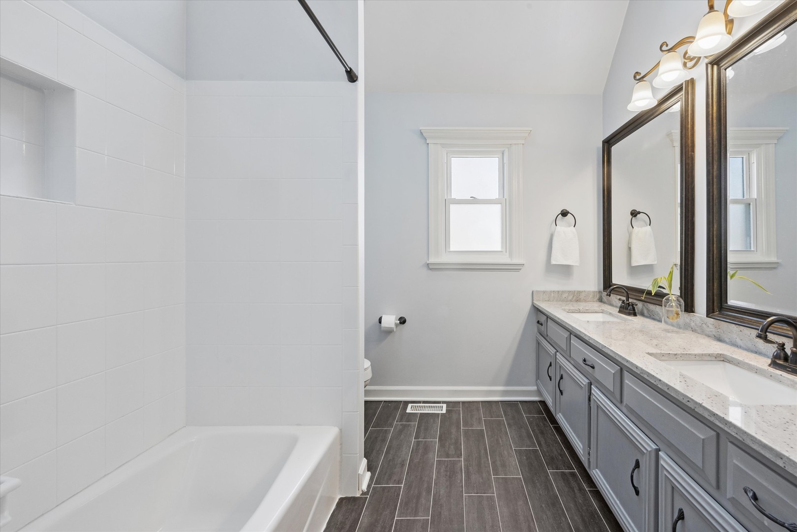 2711 Wendy Road Naperville, IL 60565 - Photo 29 of 49 a bathroom with a sink a bathtub and a mirror